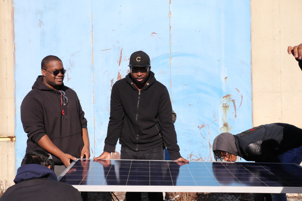Solar Training students learn about solar panels Photo Credit Lauren Robinson